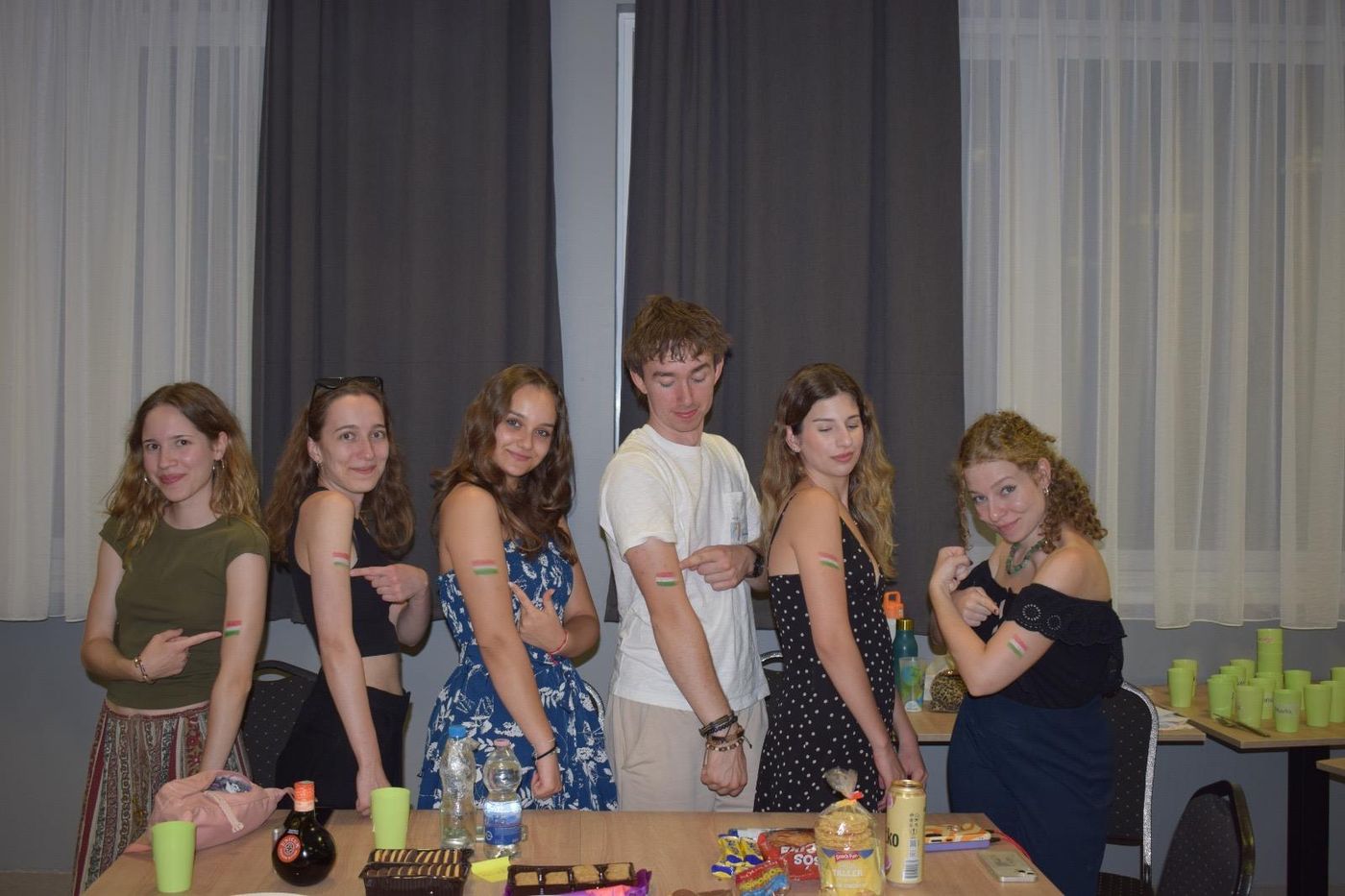 The Hungarian group showing Hungarian flags painted on their arms at the intercultural night
